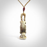 Hand carved deer antler, bone skeleton doing a head stand pendant online for sale. Creative necklace for lovers of skeletons hand made from deer antler, bone. Free shipping worldwide. We provide this pendant with an adjustable cord.